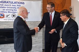 Dr. Jack Ives congratulated by  H.E. Simon Tucker